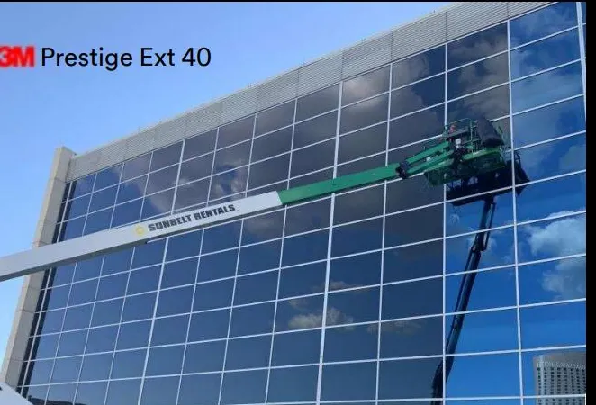 Installation of 3M Prestige Exterior 40 film on office building